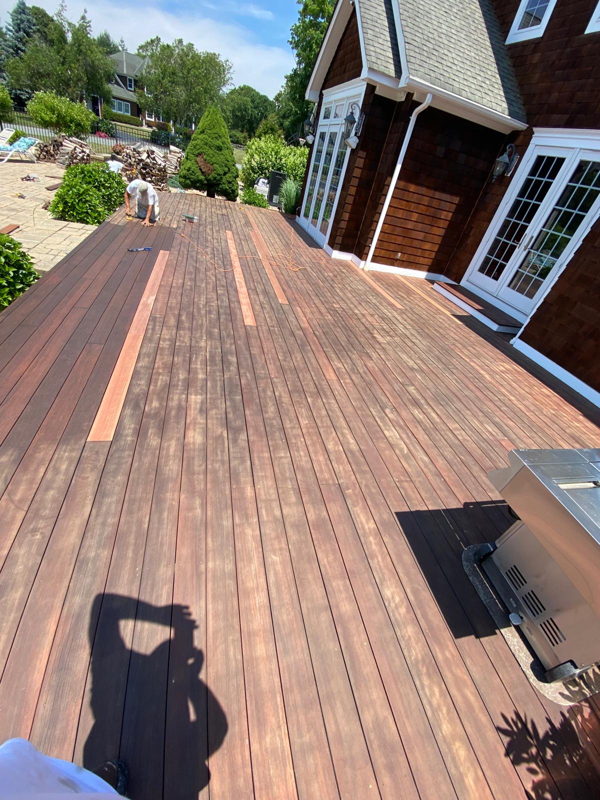Backyard deck refinished with rich semi-transparent stain