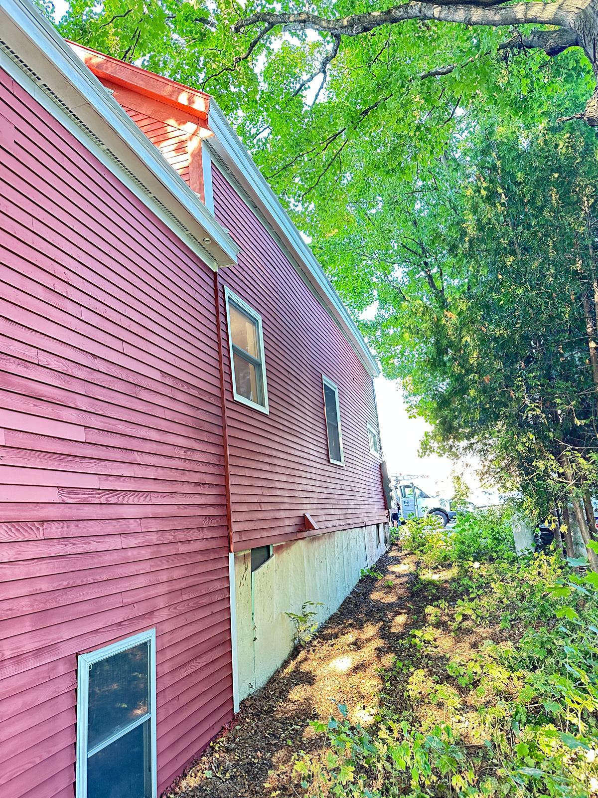 Fence staining project with uniform natural wood tone