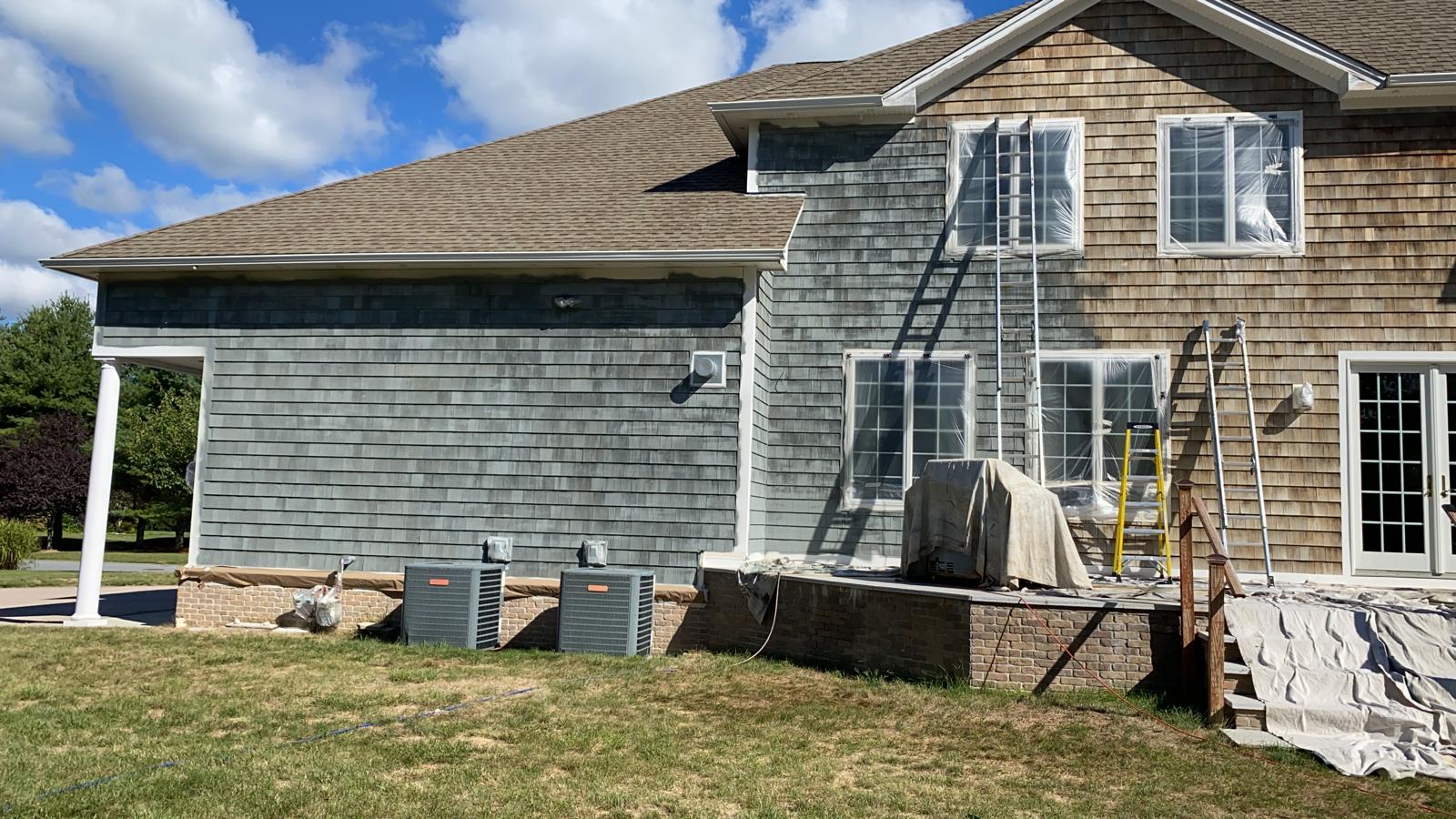Fence staining project with uniform natural wood tone