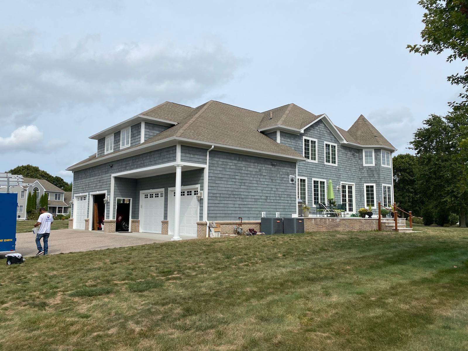 Fence staining project with uniform natural wood tone