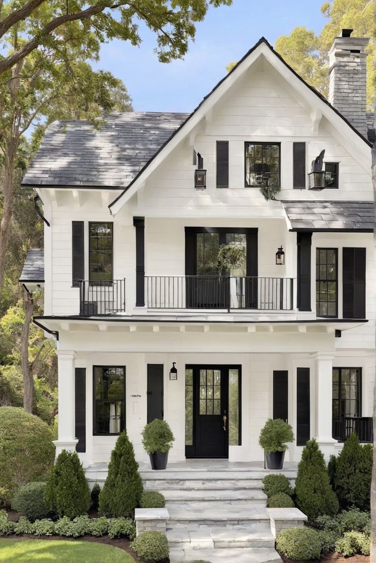 Staircase and railings with crisp white and dark handrail