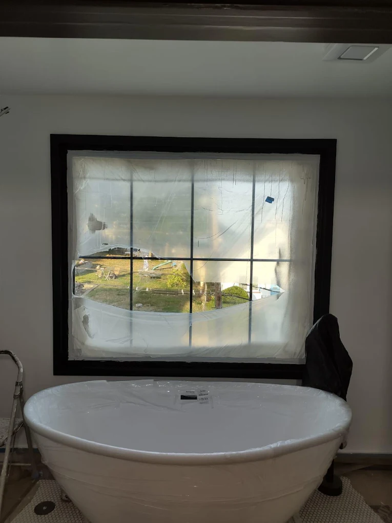 Baseboards and casings repainted to match new wall color